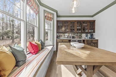 OVERLOOKING THE SIGNATURE 5TH HOLE OF THE JACK NICKLAUS DESIGNED on Great Waters Course At Reynolds Plantation in Georgia - for sale on GolfHomes.com, golf home, golf lot