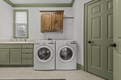 OVERLOOKING THE SIGNATURE 5TH HOLE OF THE JACK NICKLAUS DESIGNED on Great Waters Course At Reynolds Plantation in Georgia - for sale on GolfHomes.com, golf home, golf lot