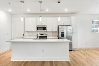 This beautifully situated FIRST FLOOR END unit carriage home in on Highland Woods Golf and Country Club in Florida - for sale on GolfHomes.com, golf home, golf lot