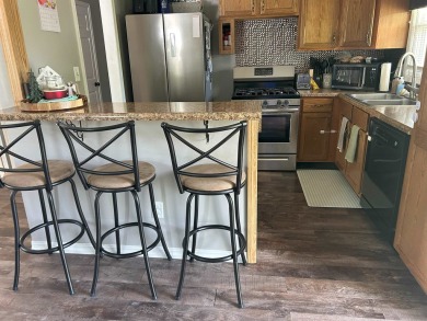 Must see this three bedroom, 1.5 bath home close to golf course on Park Hills Golf Course in Illinois - for sale on GolfHomes.com, golf home, golf lot