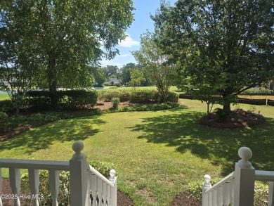 This charming farmhouse-style home with wraparound porches on Ocean Ridge Plantation in North Carolina - for sale on GolfHomes.com, golf home, golf lot