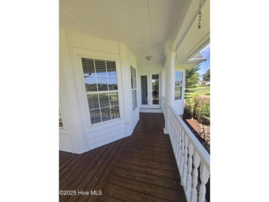 This charming farmhouse-style home with wraparound porches on Ocean Ridge Plantation in North Carolina - for sale on GolfHomes.com, golf home, golf lot