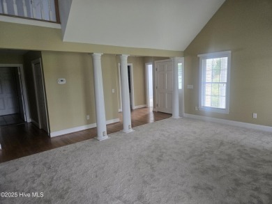 This charming farmhouse-style home with wraparound porches on Ocean Ridge Plantation in North Carolina - for sale on GolfHomes.com, golf home, golf lot