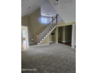 This charming farmhouse-style home with wraparound porches on Ocean Ridge Plantation in North Carolina - for sale on GolfHomes.com, golf home, golf lot