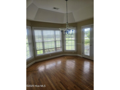 This charming farmhouse-style home with wraparound porches on Ocean Ridge Plantation in North Carolina - for sale on GolfHomes.com, golf home, golf lot
