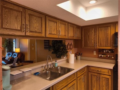 One or more photo(s) has been virtually staged. This villa at on Mainlands Golf Club in Florida - for sale on GolfHomes.com, golf home, golf lot