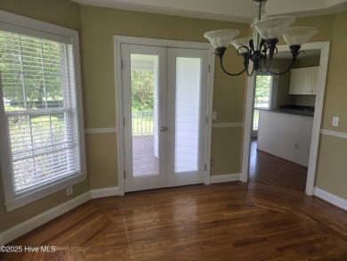 This charming farmhouse-style home with wraparound porches on Ocean Ridge Plantation in North Carolina - for sale on GolfHomes.com, golf home, golf lot