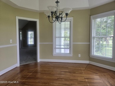This charming farmhouse-style home with wraparound porches on Ocean Ridge Plantation in North Carolina - for sale on GolfHomes.com, golf home, golf lot