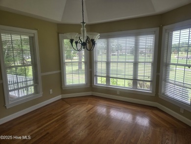 This charming farmhouse-style home with wraparound porches on Ocean Ridge Plantation in North Carolina - for sale on GolfHomes.com, golf home, golf lot
