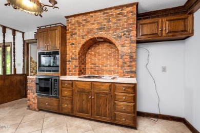 Exquisite single-family Tudor residence nestled in the charming on Keith Hills Country Club  in North Carolina - for sale on GolfHomes.com, golf home, golf lot