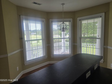This charming farmhouse-style home with wraparound porches on Ocean Ridge Plantation in North Carolina - for sale on GolfHomes.com, golf home, golf lot