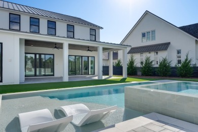 A stunning fusion of modern elegance and sophistication, nestled on Camp Creek Golf Course in Florida - for sale on GolfHomes.com, golf home, golf lot