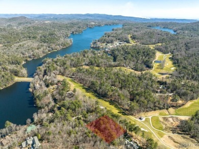 This .57-acre lot nestled on Fairway Drive sits on 4 golf hole on Lake Toxaway Country Club in North Carolina - for sale on GolfHomes.com, golf home, golf lot