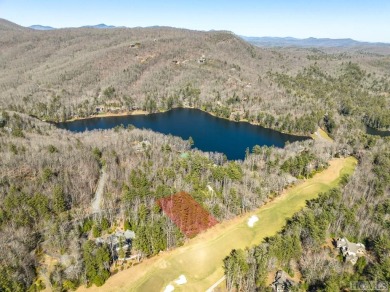 This .57-acre lot nestled on Fairway Drive sits on 4 golf hole on Lake Toxaway Country Club in North Carolina - for sale on GolfHomes.com, golf home, golf lot