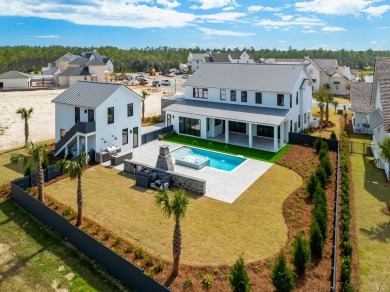 A stunning fusion of modern elegance and sophistication, nestled on Camp Creek Golf Course in Florida - for sale on GolfHomes.com, golf home, golf lot