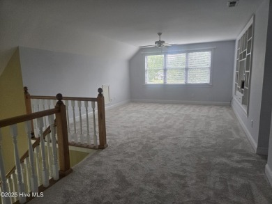 This charming farmhouse-style home with wraparound porches on Ocean Ridge Plantation in North Carolina - for sale on GolfHomes.com, golf home, golf lot