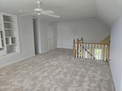 This charming farmhouse-style home with wraparound porches on Ocean Ridge Plantation in North Carolina - for sale on GolfHomes.com, golf home, golf lot