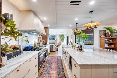 Welcome to this truly one-of-a-kind residence in Eagle Ridge on Eagle Ridge Golf and Tennis Club in Florida - for sale on GolfHomes.com, golf home, golf lot