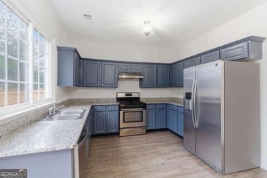 Lovely home in a prime Johns Creek location, tucked in an active on The Standard Club in Georgia - for sale on GolfHomes.com, golf home, golf lot