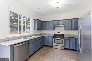 Lovely home in a prime Johns Creek location, tucked in an active on The Standard Club in Georgia - for sale on GolfHomes.com, golf home, golf lot