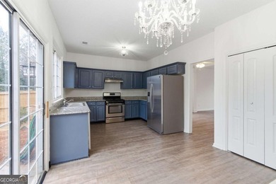 Lovely home in a prime Johns Creek location, tucked in an active on The Standard Club in Georgia - for sale on GolfHomes.com, golf home, golf lot