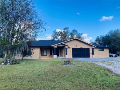 5 BED 3 BATH WATERFRONT CANAL POOL HOME WITH WATER ACCESS TO THE on Deep Creek Golf Club in Florida - for sale on GolfHomes.com, golf home, golf lot