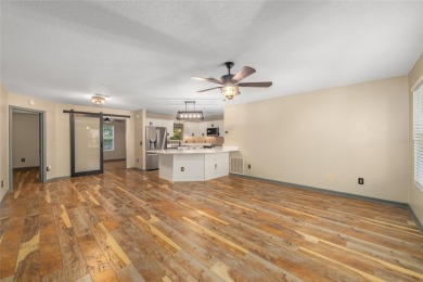 This modified Austin Model in the Village of Alhambra is priced on The Links of Spruce Creek in Florida - for sale on GolfHomes.com, golf home, golf lot