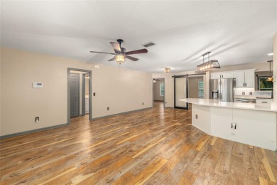 This modified Austin Model in the Village of Alhambra is priced on The Links of Spruce Creek in Florida - for sale on GolfHomes.com, golf home, golf lot