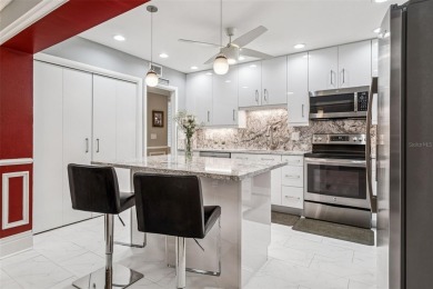 Meticulously maintained, beautifully updated and is very well on Carrollwood Country Club in Florida - for sale on GolfHomes.com, golf home, golf lot
