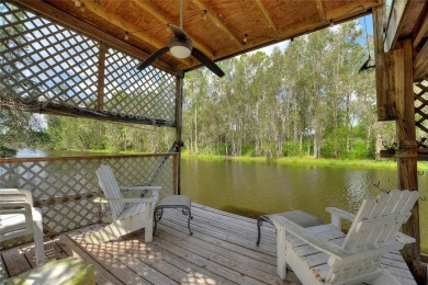 Charming Canal-Front Home on a Full Acre in Indian Lake Estates! on Indian Lake Estates Golf and Country Club in Florida - for sale on GolfHomes.com, golf home, golf lot