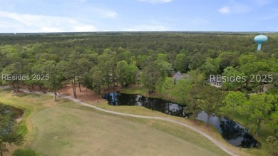A view that stops you in your tracks - lagoon to golf, as far as on Moss Creek Golf Club in South Carolina - for sale on GolfHomes.com, golf home, golf lot
