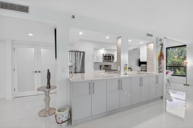 Discover luxury living in this beautifully renovated condo at on Boca West Golf and Country Club in Florida - for sale on GolfHomes.com, golf home, golf lot