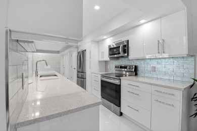 Discover luxury living in this beautifully renovated condo at on Boca West Golf and Country Club in Florida - for sale on GolfHomes.com, golf home, golf lot