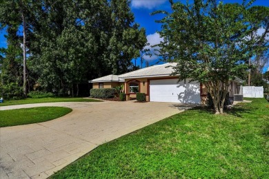 Discover the charm of 57 Woodhollow Dr, a stunning custom-built on The Grand Club - Pine Lakes Course in Florida - for sale on GolfHomes.com, golf home, golf lot