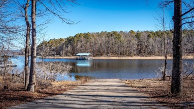 Discover your dream retreat on the picturesque shores of Greers on Thunderbird Country Club in Arkansas - for sale on GolfHomes.com, golf home, golf lot