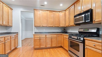 Discover this beautifully maintained 5-bedroom, 3.5 bath home on Summergrove Golf Club in Georgia - for sale on GolfHomes.com, golf home, golf lot