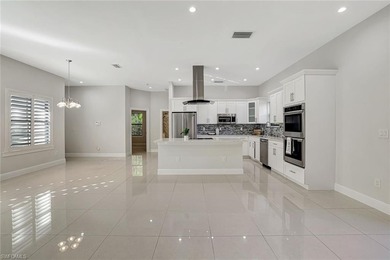 Set back on a private 1.14-acre lot, this beautifully designed on The Club At Twin Eagles in Florida - for sale on GolfHomes.com, golf home, golf lot