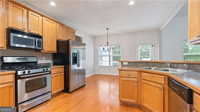 Discover this beautifully maintained 5-bedroom, 3.5 bath home on Summergrove Golf Club in Georgia - for sale on GolfHomes.com, golf home, golf lot