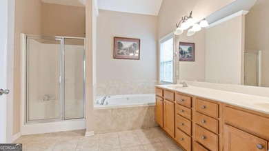 Discover this beautifully maintained 5-bedroom, 3.5 bath home on Summergrove Golf Club in Georgia - for sale on GolfHomes.com, golf home, golf lot