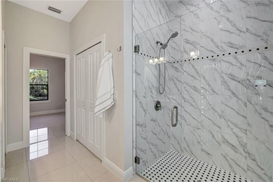 Set back on a private 1.14-acre lot, this beautifully designed on The Club At Twin Eagles in Florida - for sale on GolfHomes.com, golf home, golf lot