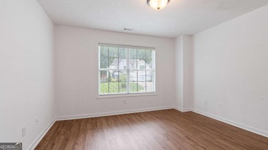 Discover this beautifully maintained 5-bedroom, 3.5 bath home on Summergrove Golf Club in Georgia - for sale on GolfHomes.com, golf home, golf lot