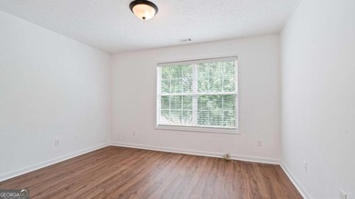 Discover this beautifully maintained 5-bedroom, 3.5 bath home on Summergrove Golf Club in Georgia - for sale on GolfHomes.com, golf home, golf lot