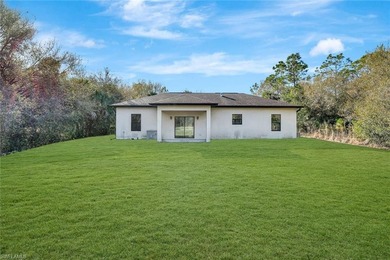 Set back on a private 1.14-acre lot, this beautifully designed on The Club At Twin Eagles in Florida - for sale on GolfHomes.com, golf home, golf lot