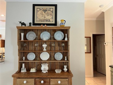 Beautifully maintained home in Solivita. Gorgeous landscaping on Stonegate Golf Club in Florida - for sale on GolfHomes.com, golf home, golf lot