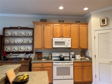 Beautifully maintained home in Solivita. Gorgeous landscaping on Stonegate Golf Club in Florida - for sale on GolfHomes.com, golf home, golf lot