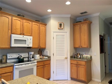 Beautifully maintained home in Solivita. Gorgeous landscaping on Stonegate Golf Club in Florida - for sale on GolfHomes.com, golf home, golf lot