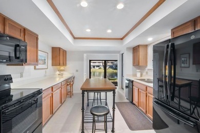 Furnished 2-bed, 2-bath waterfront villa in The Lakes of Deer on Deer Creek Golf Club in Florida - for sale on GolfHomes.com, golf home, golf lot