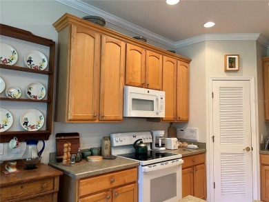 Beautifully maintained home in Solivita. Gorgeous landscaping on Stonegate Golf Club in Florida - for sale on GolfHomes.com, golf home, golf lot