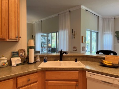 Beautifully maintained home in Solivita. Gorgeous landscaping on Stonegate Golf Club in Florida - for sale on GolfHomes.com, golf home, golf lot