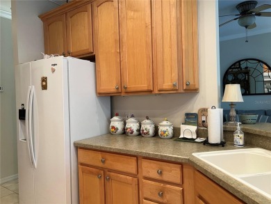 Beautifully maintained home in Solivita. Gorgeous landscaping on Stonegate Golf Club in Florida - for sale on GolfHomes.com, golf home, golf lot